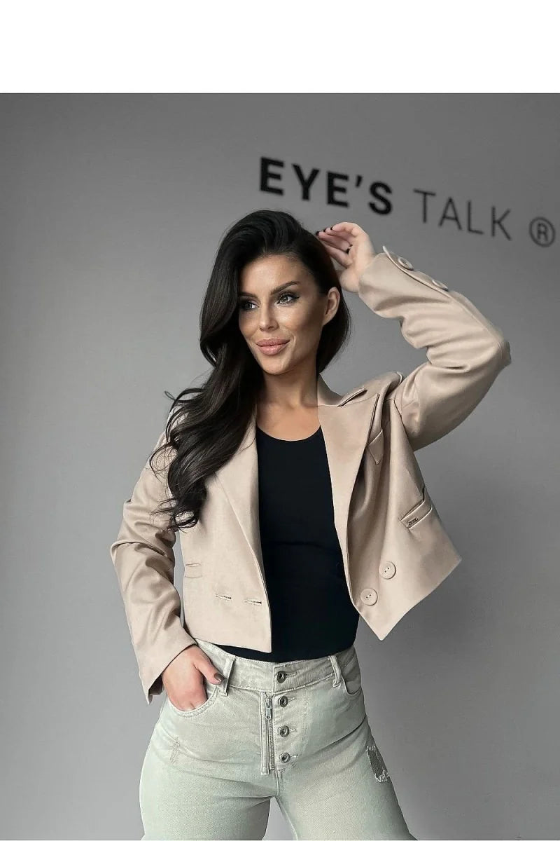 Beige cropped blazer with double button closure, on model wearing light wash jeans.