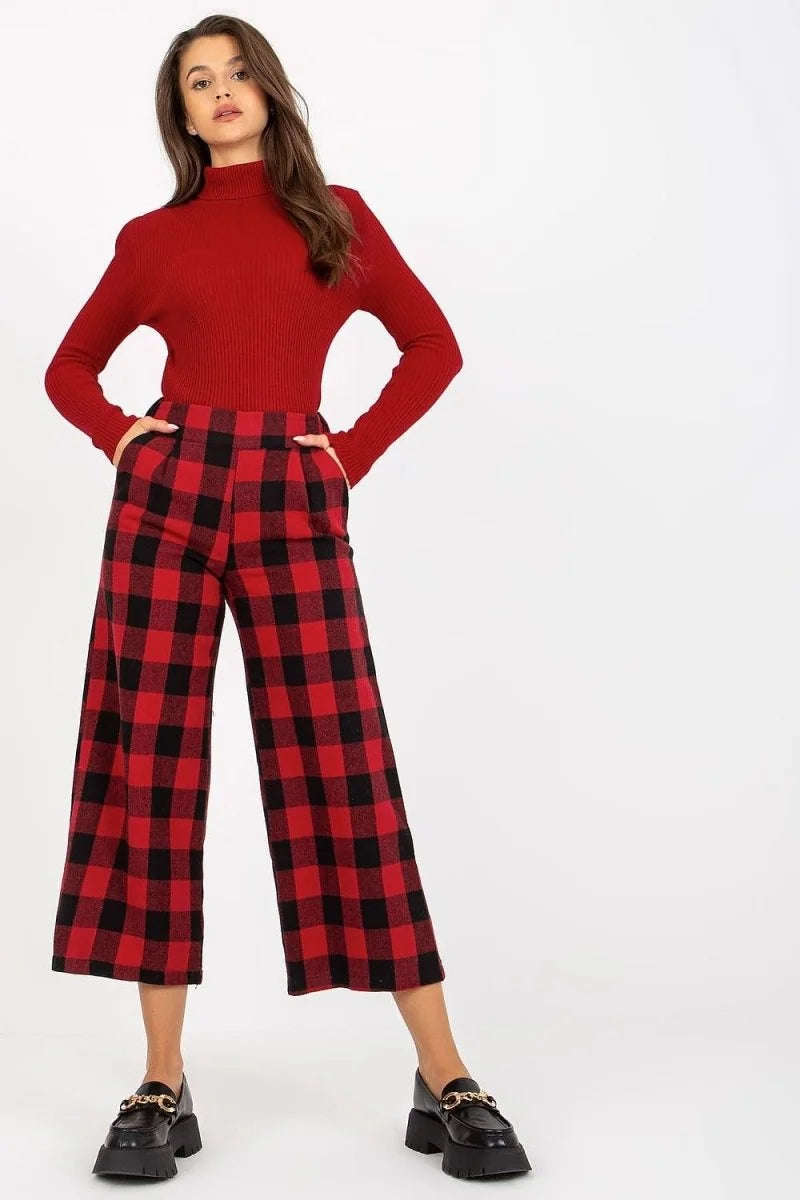 Red and black checkered wool culottes with a regular fit, shown on a model.
