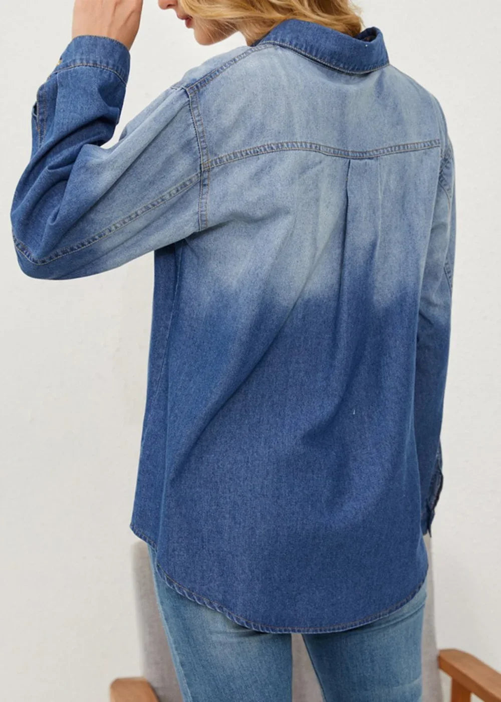 Back view of a denim shirt with a blue gradient fade, featuring a regular fit and long sleeves.