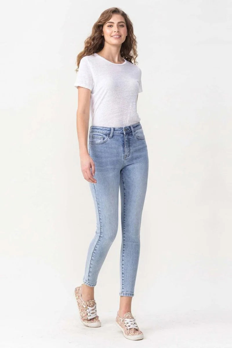 Light blue wash skinny jeans with a high waist and a full-length inseam, on a model.