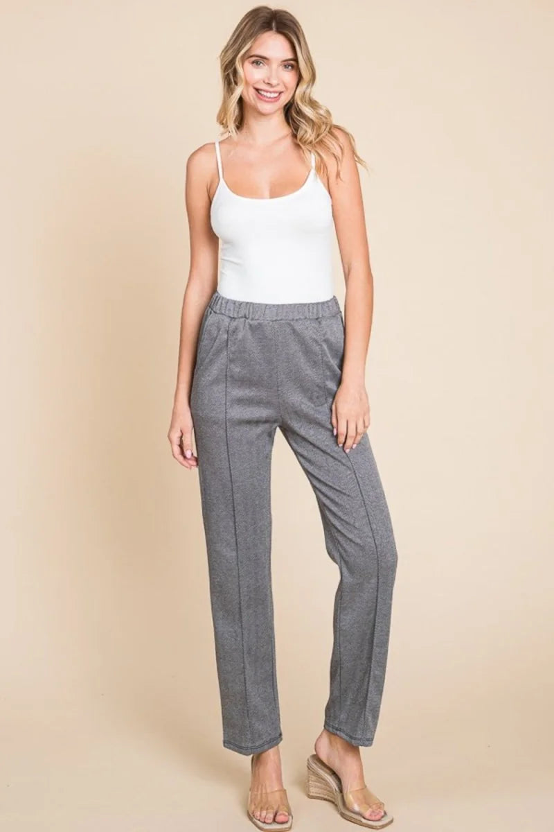Full-length gray textured pants with a regular fit and seam detail.