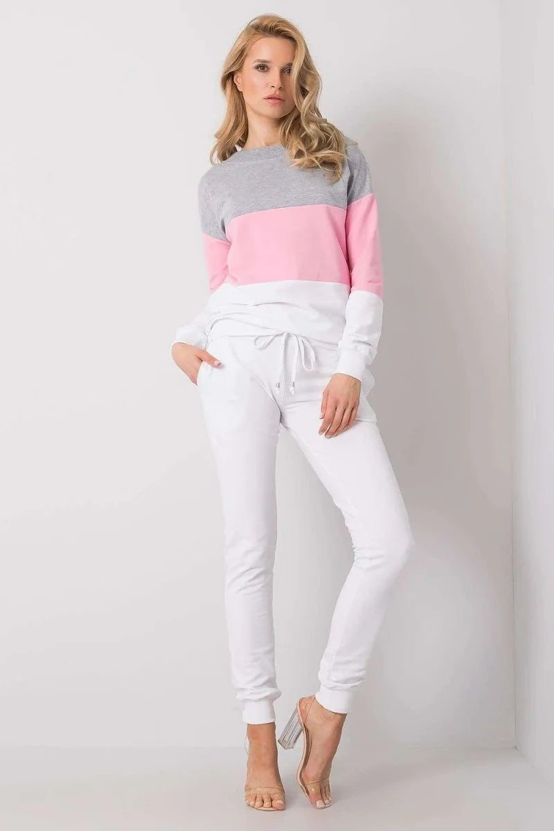White joggers with a drawstring waist and clear block heels on model.