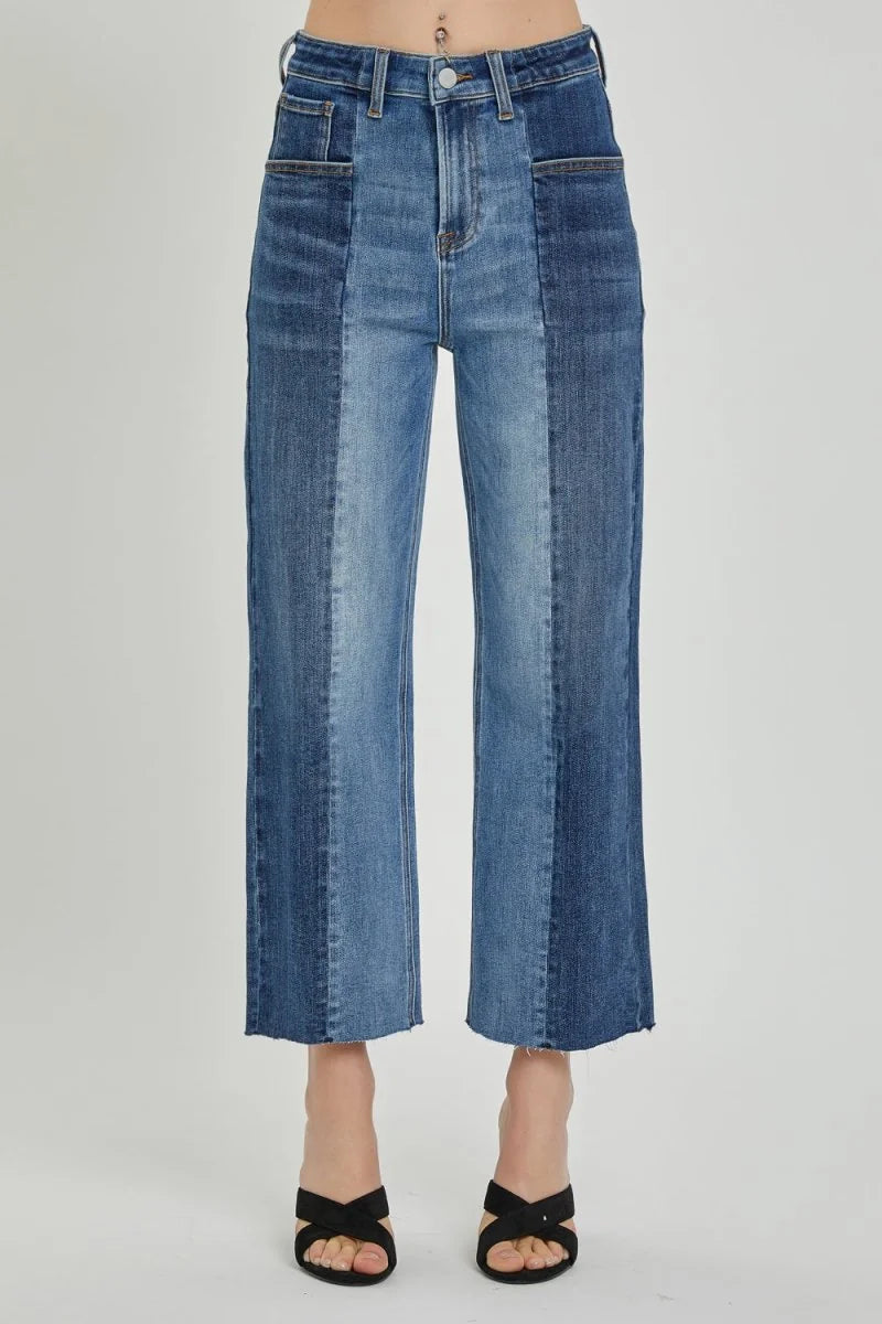 Two-toned blue denim jeans with a slightly stretchy fit, featuring a frayed hem.