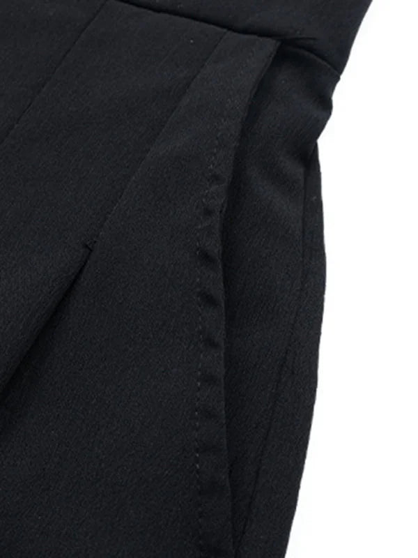 Close-up of black polyester fabric showing a clean, stitched pocket opening.