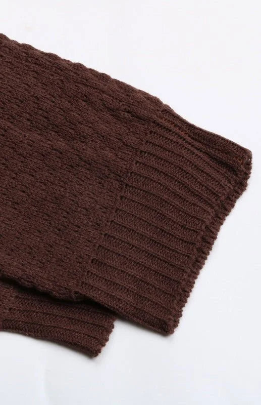 Close-up of brown knit fabric with ribbed cuff detail on a sleeve.