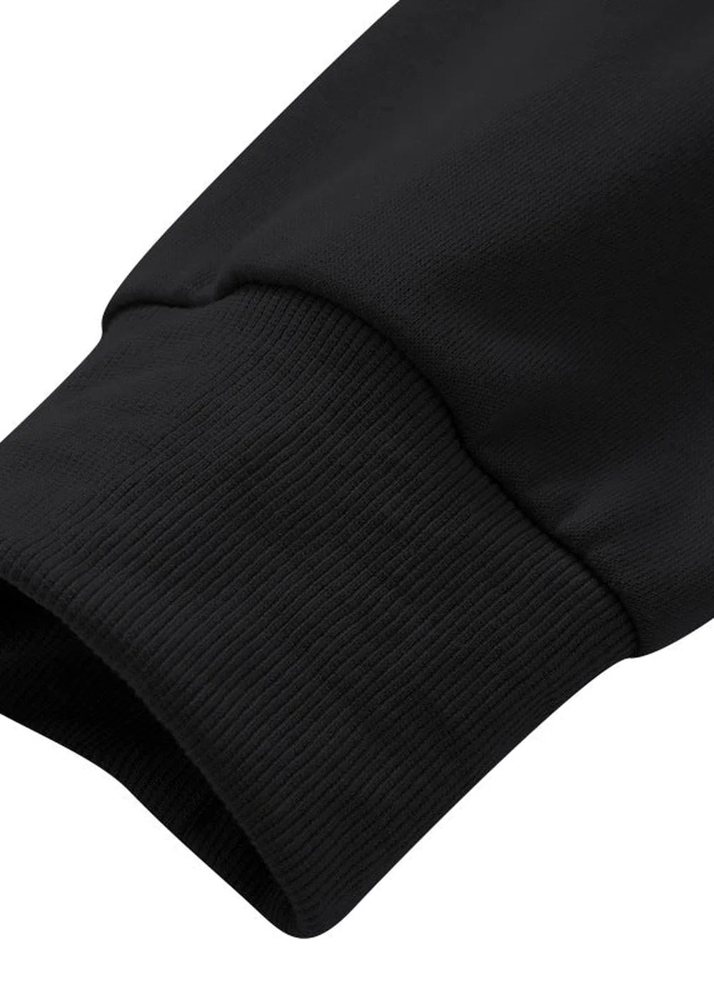 Close-up of a black ribbed knit cuff on a sleeve made of soft, textured polyester-spandex blend fabric.