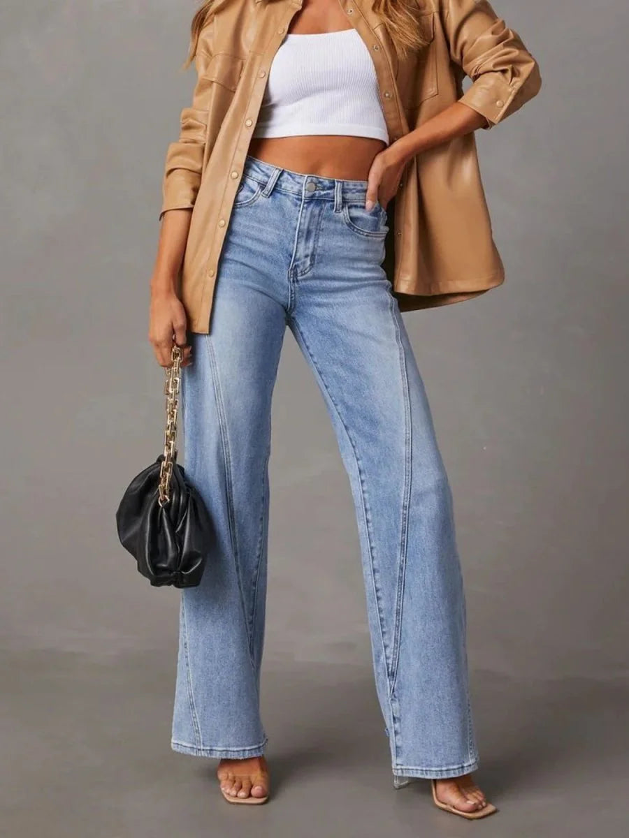 Light blue wide-leg jeans with a regular fit, featuring subtle seam detailing down the legs.