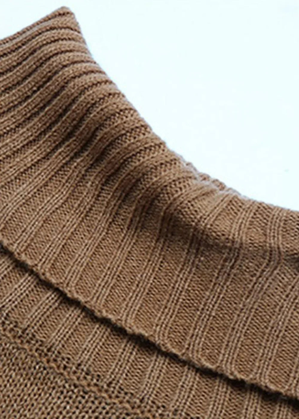 Close-up of a brown ribbed knit sweater with a cowl neck detail.