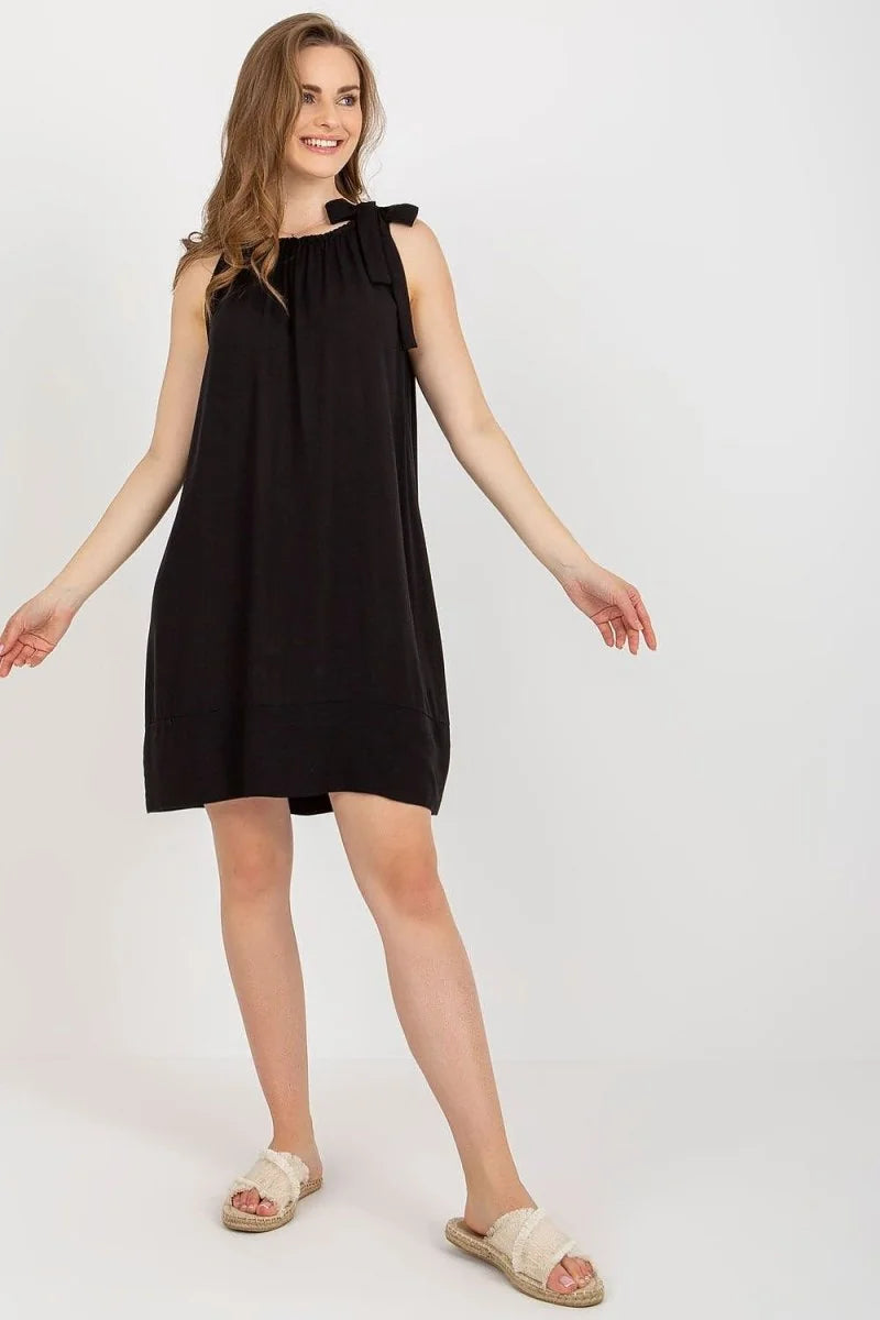 Loose black viscose mini dress with tie shoulders and frayed straw slides.