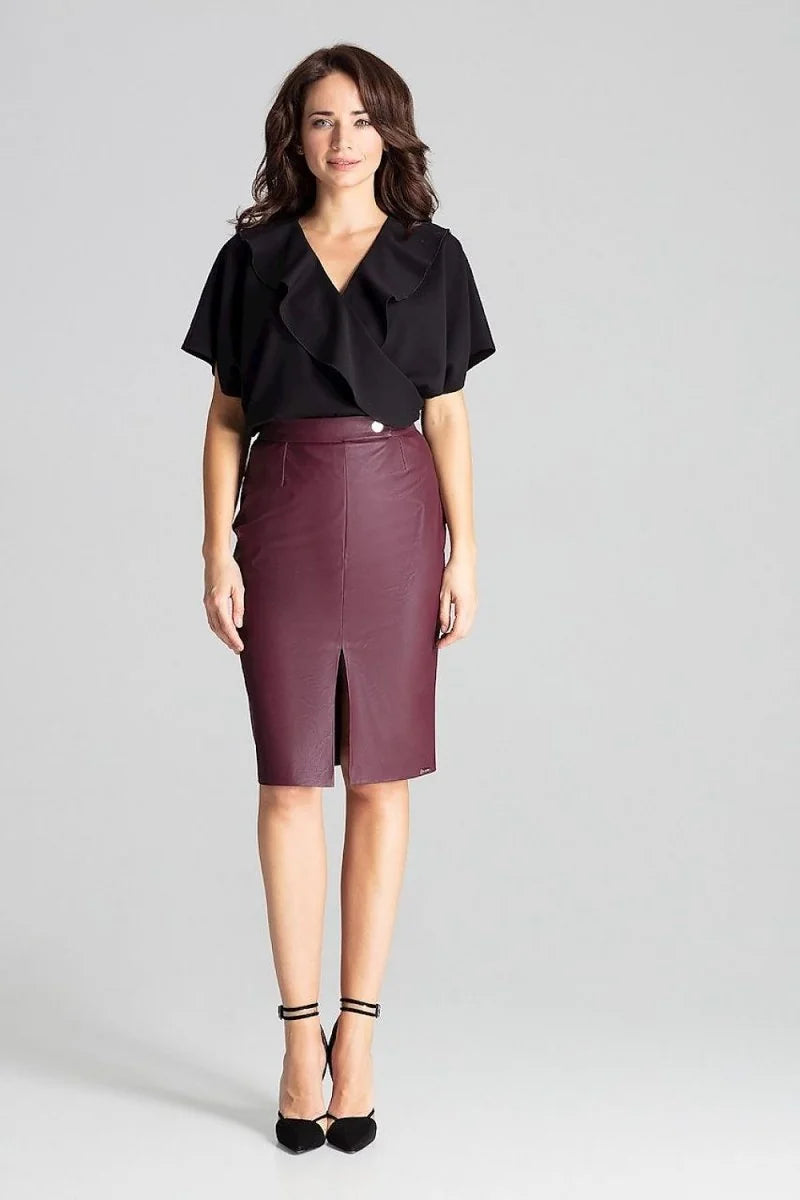 Burgundy faux leather pencil skirt with a front slit and a button closure, on a model.