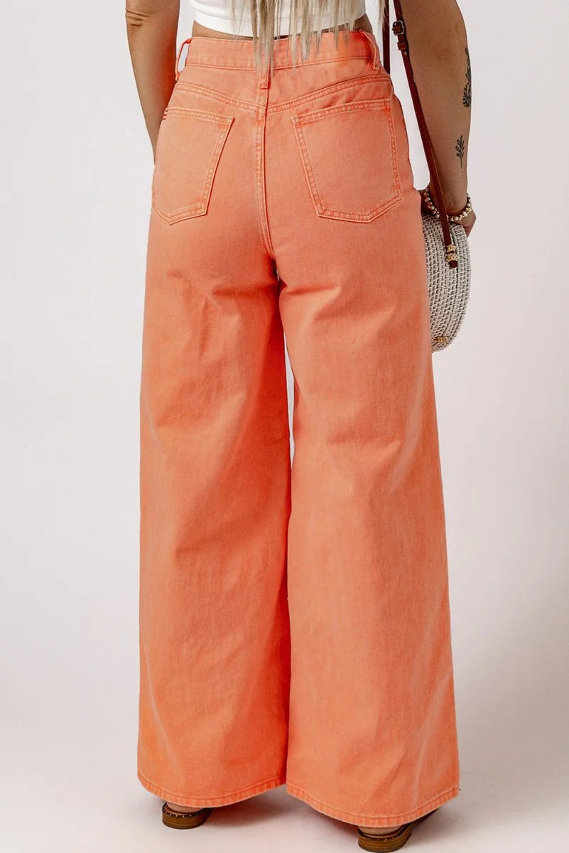 Back view of peach wide-leg jeans with a regular fit and visible stitching detail.