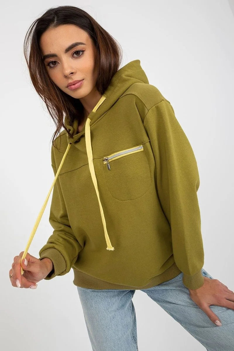 Olive green cotton-blend hoodie with yellow drawstring and zippered chest pocket on model.