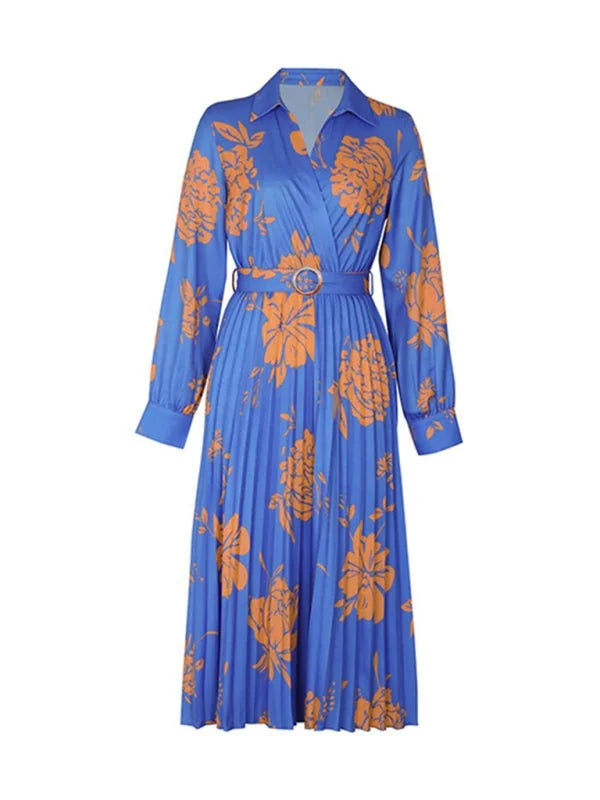 Blue pleated dress with orange floral print and belted waist, long sleeves.