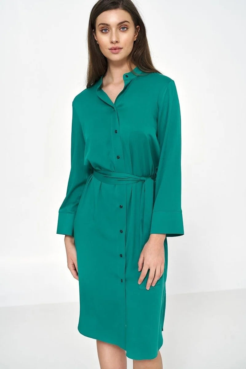 Emerald green viscose shirt dress with button front, mandarin collar, and tie waist on a model.