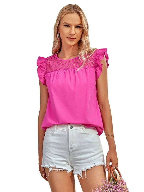 Bright pink ruffled top with eyelet detail paired with white distressed denim shorts on a model.