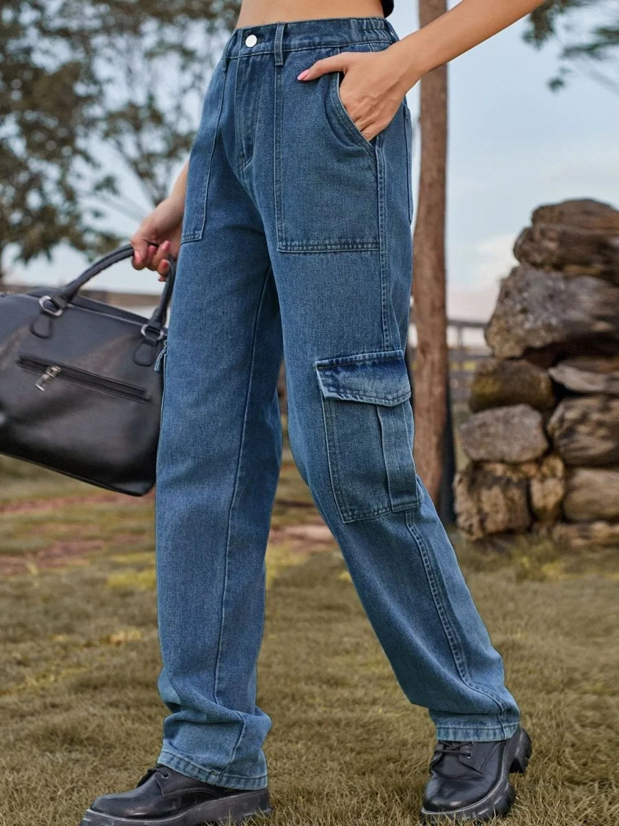 Blue denim cargo pants with large patch pockets and a relaxed fit, worn with black platform shoes.