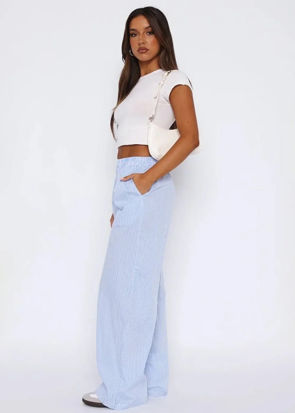 Light blue and white pinstripe wide-leg pants with pockets, on a model.
