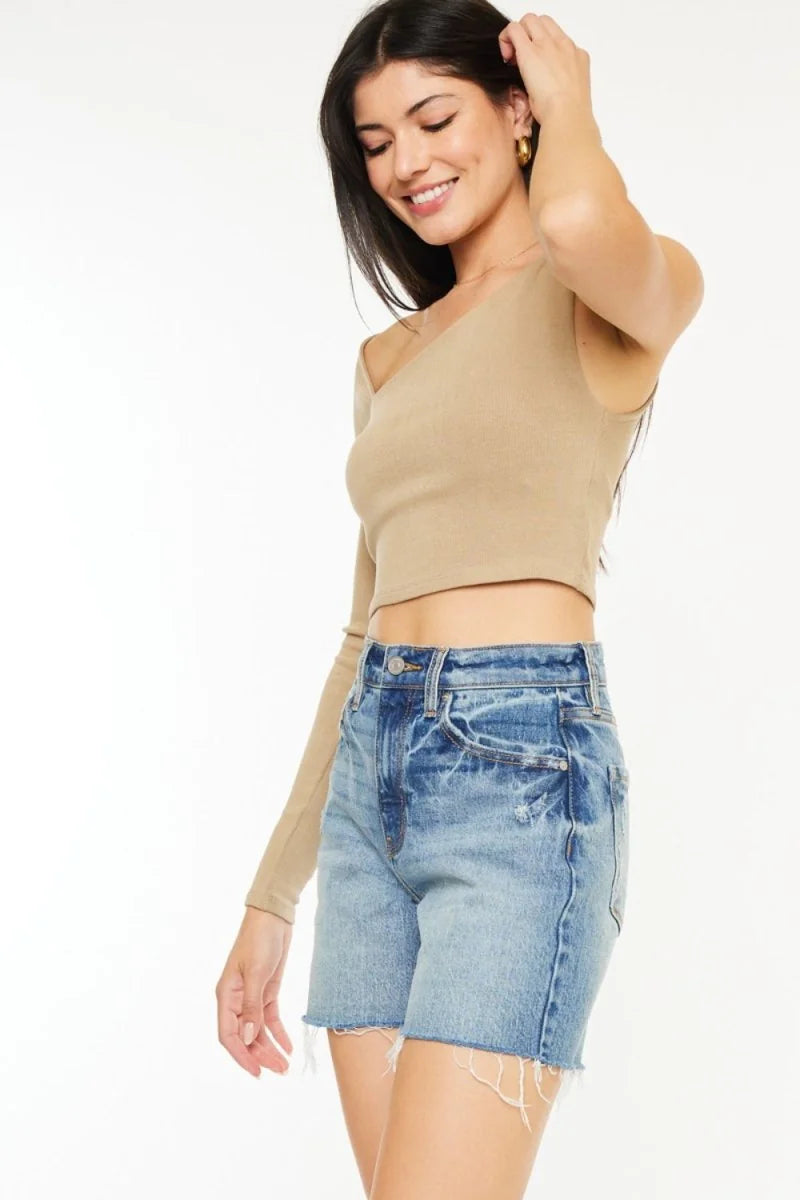 Light wash denim shorts with frayed hem and distressed details.