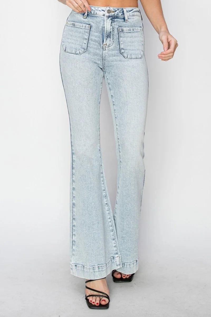 Light wash distressed denim flare jeans with large front pockets and a wide hem.