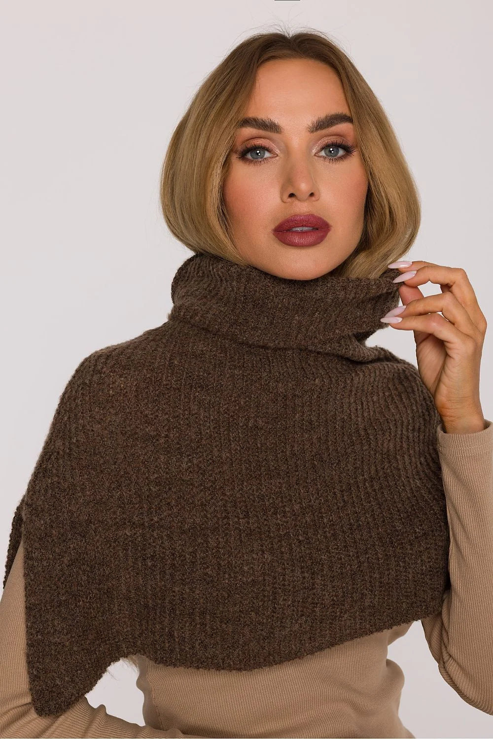 Close-up of a woman wearing a brown ribbed turtleneck collar made of a textured wool blend.