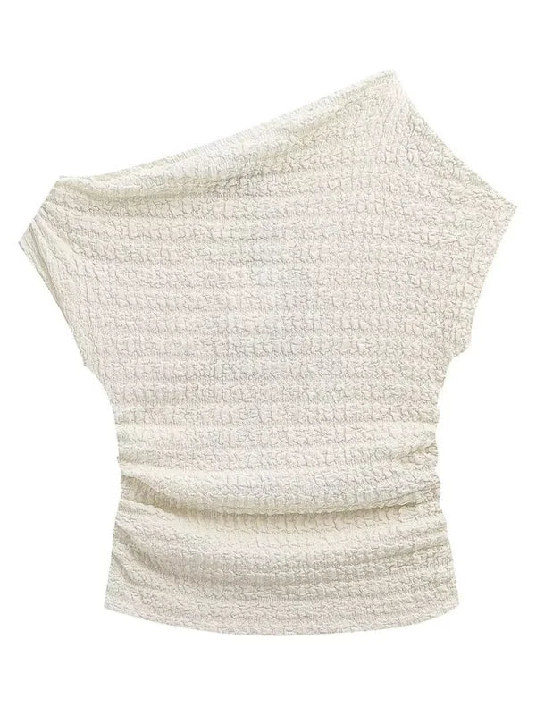 Textured off-the-shoulder white top with ruched sides.