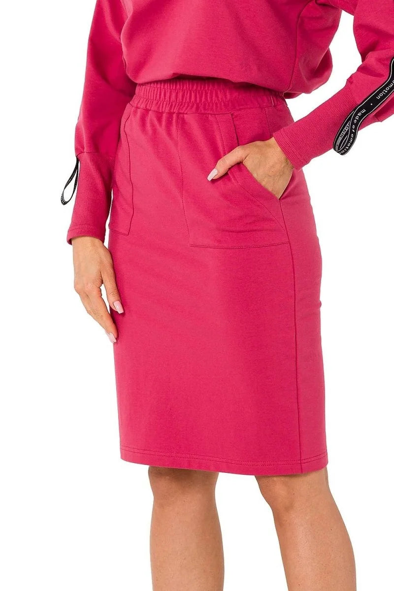 Fuchsia cotton-blend skirt with elastic waistband, pockets, and ribbed trim on the sleeves.