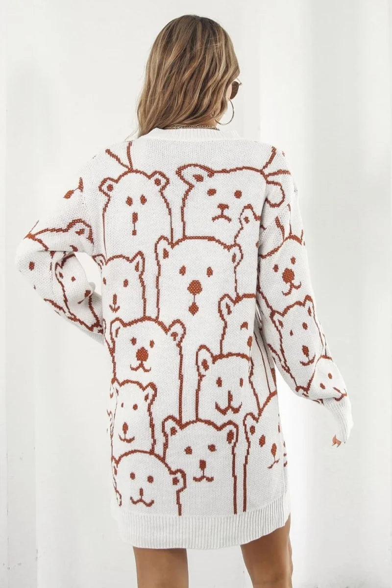 White acrylic sweater dress with a repeating brown bear pattern, long sleeves, and a regular fit.