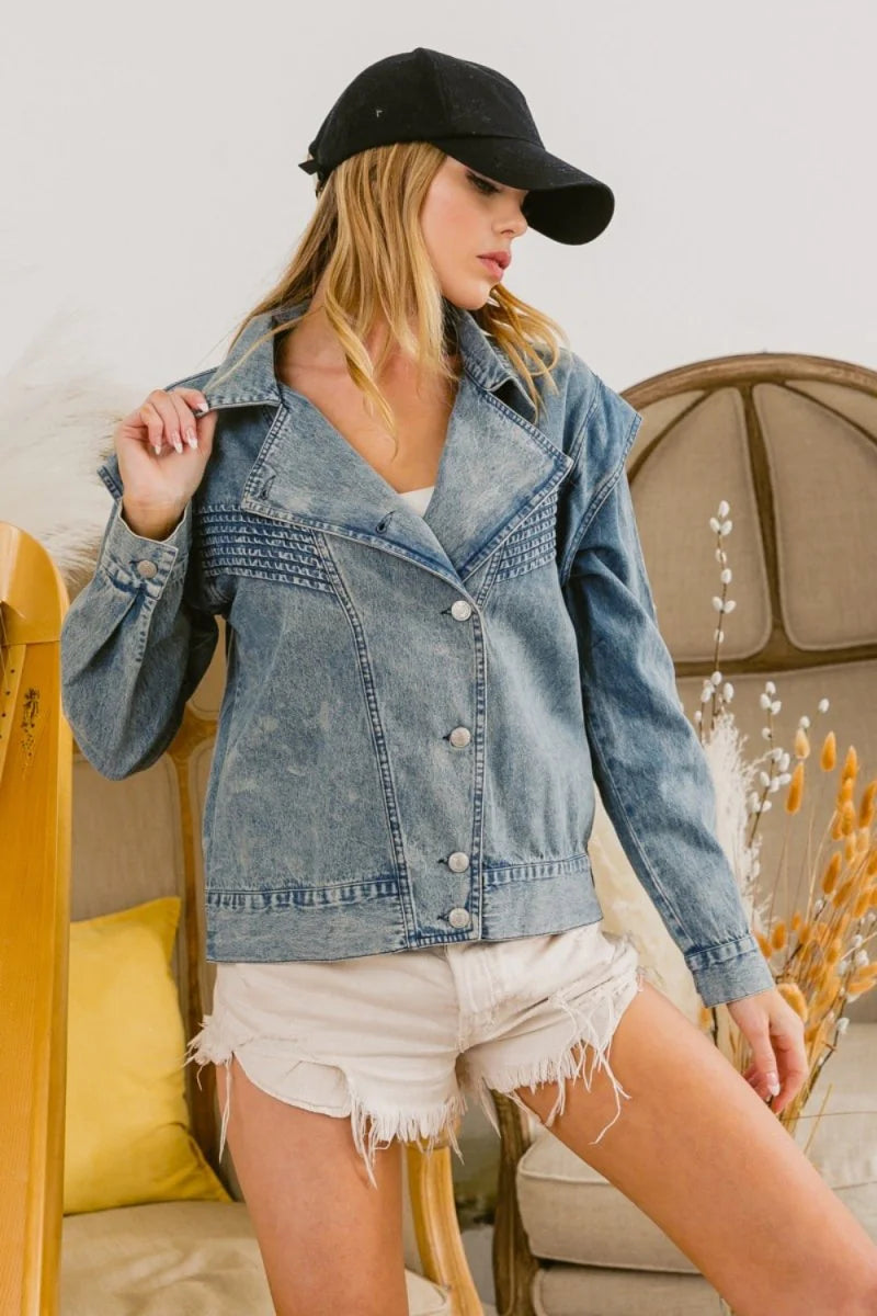 Light wash denim jacket with textured yoke and frayed white denim shorts on a model.
