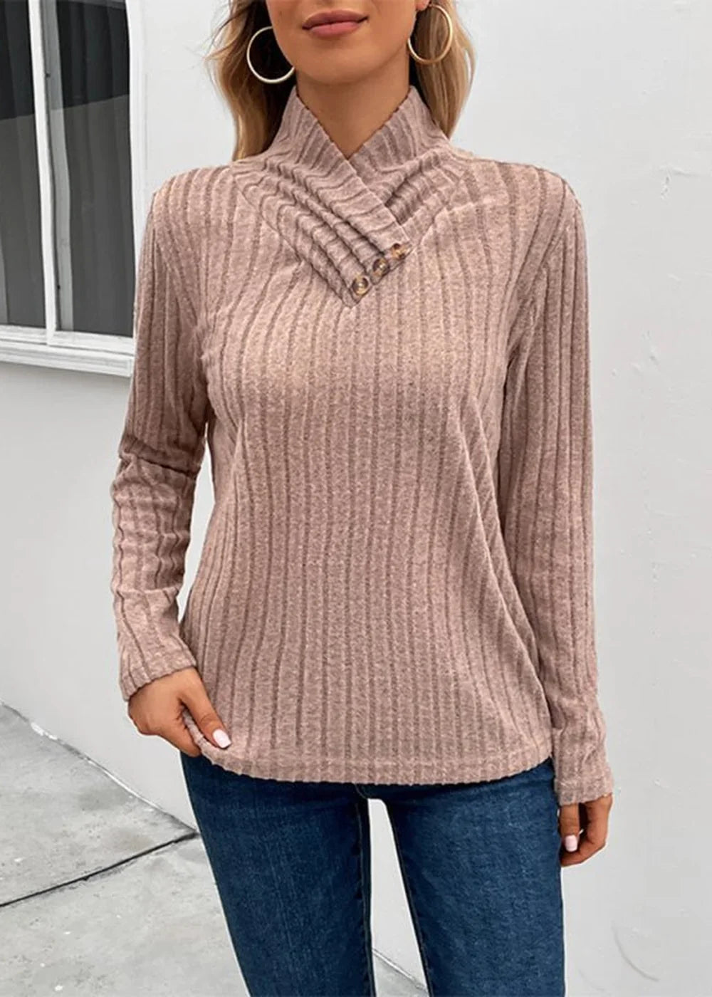 Ribbed knit taupe sweater with a cowl neck and button detail, on model.
