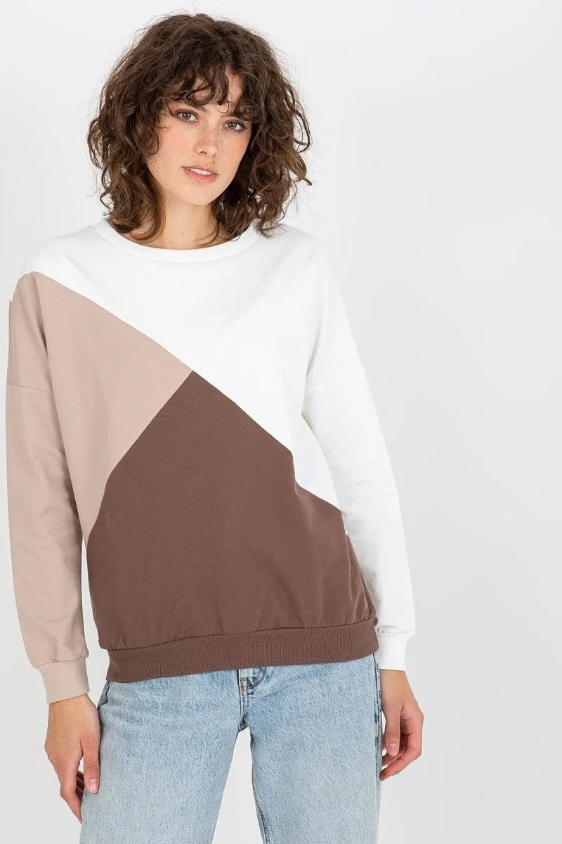 Colorblock long-sleeve sweatshirt with a geometric design in white, beige, and brown, worn by a model.