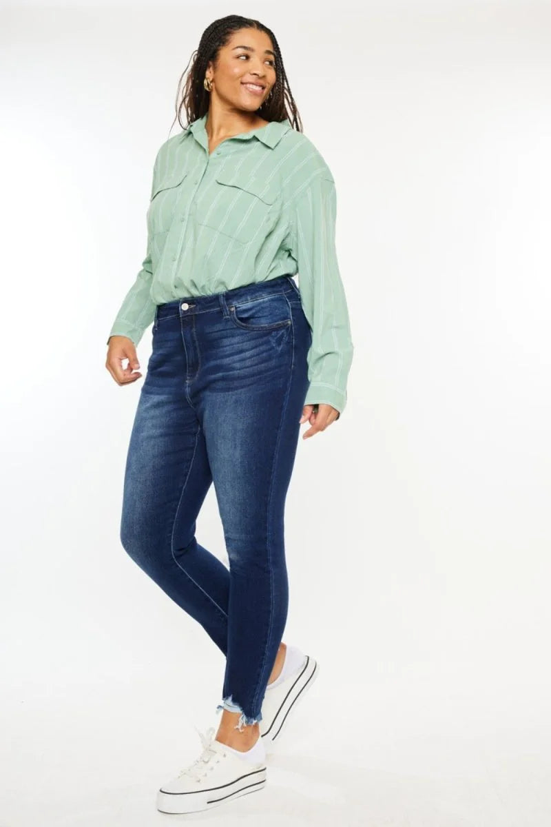 Dark wash, slightly stretchy skinny jeans with a frayed hem, shown on a model.