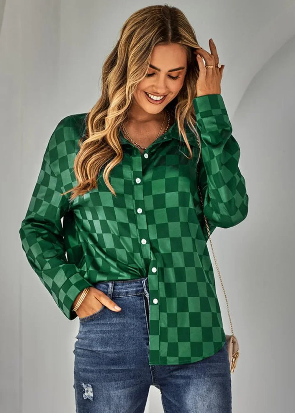 Green checkered long-sleeve button-up shirt with a satiny sheen, worn by a model with blue jeans.