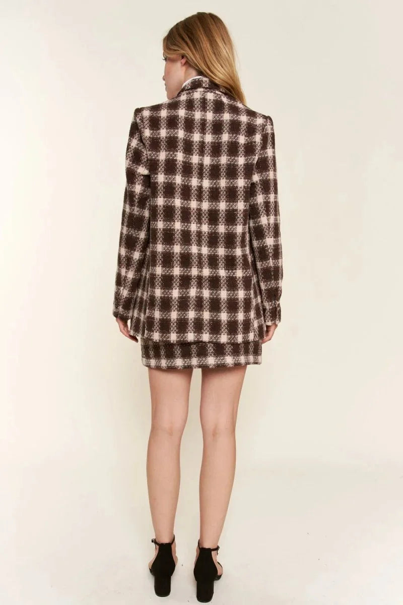 Back view of a brown and light pink plaid blazer with a brushed texture.