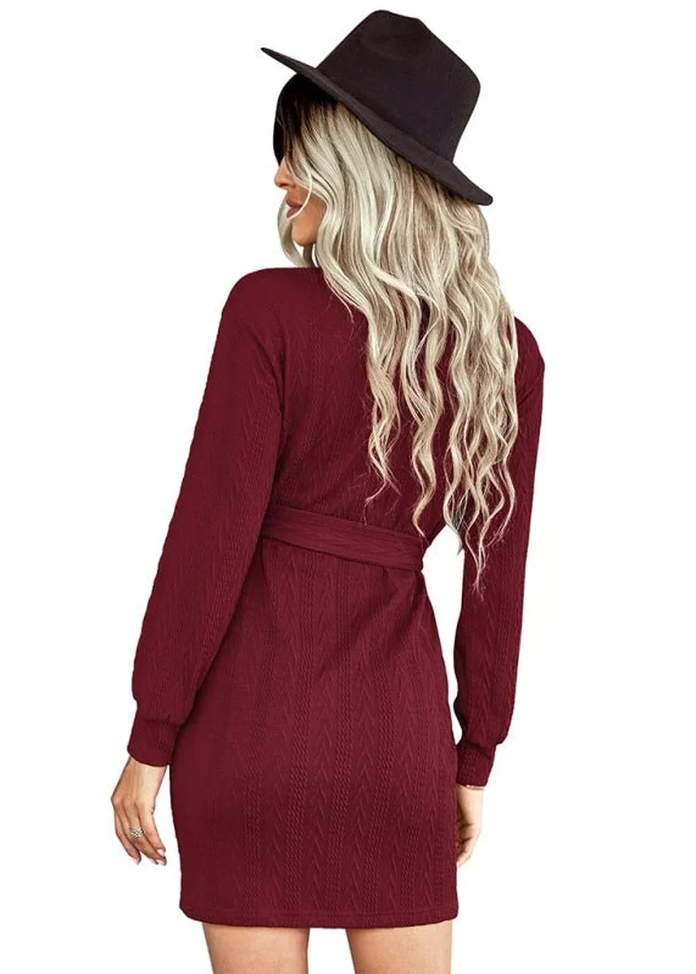 Burgundy textured long sleeve dress with belt, worn by model from behind, wearing a black hat.