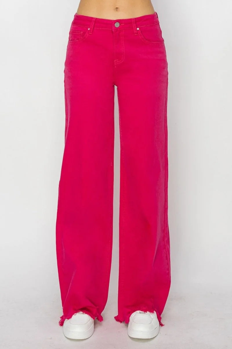 Bright pink wide-leg jeans with frayed hems and a regular fit.