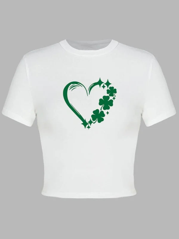 White cropped t-shirt with a green heart and clover print.