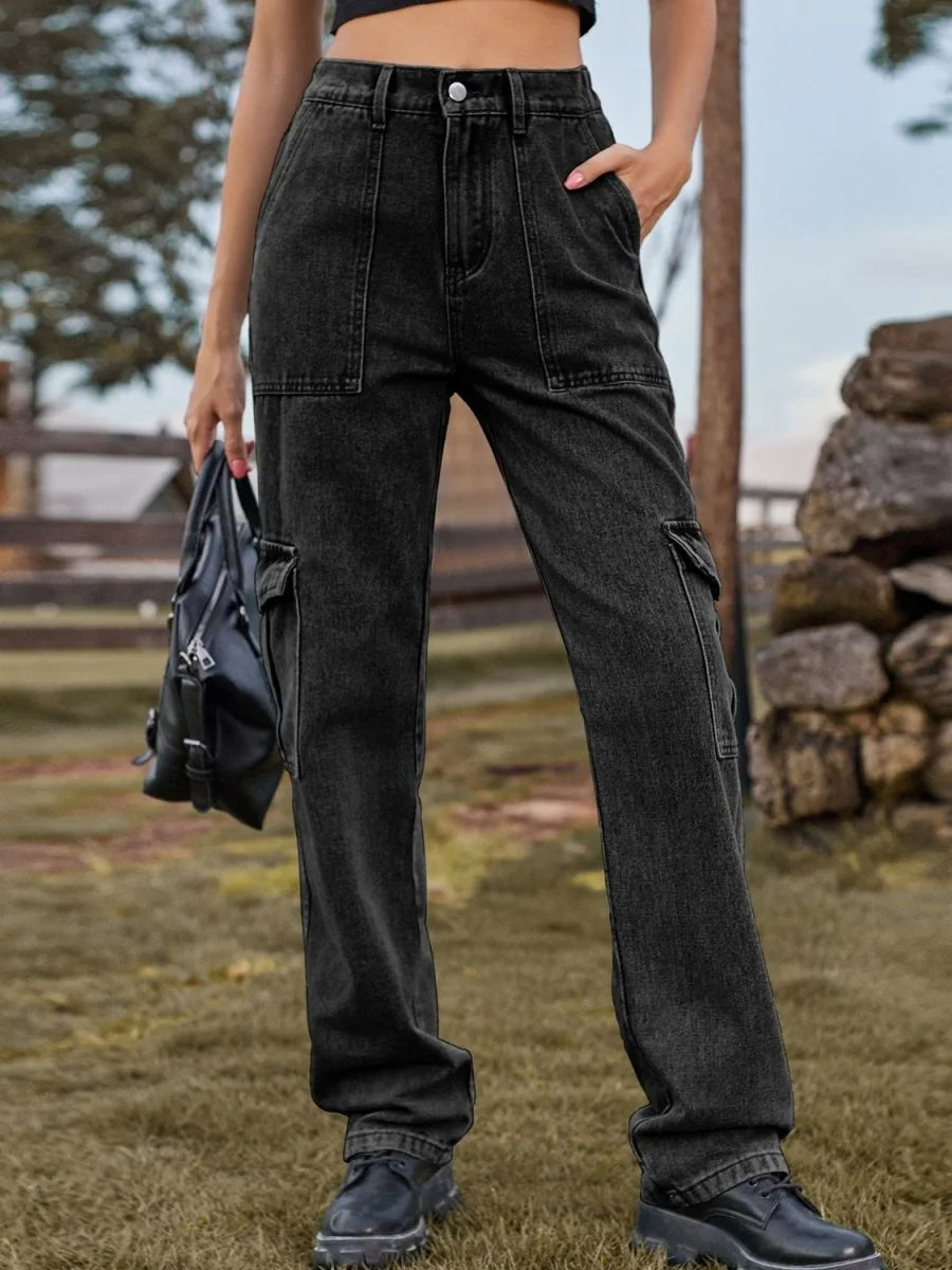 Black distressed denim cargo pants with a regular fit, shown on a model.