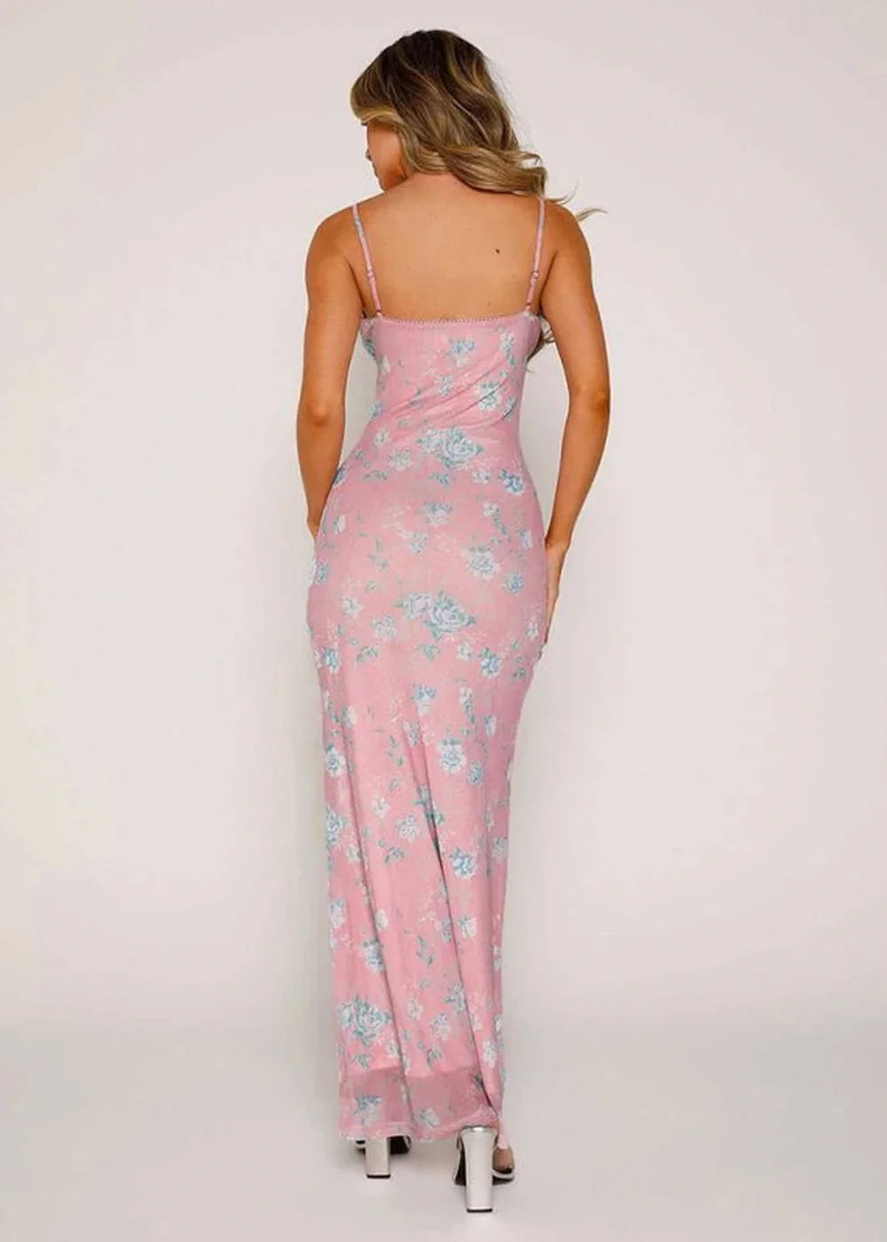 Pink floral print maxi dress with spaghetti straps and a slim fit, shown from the back.