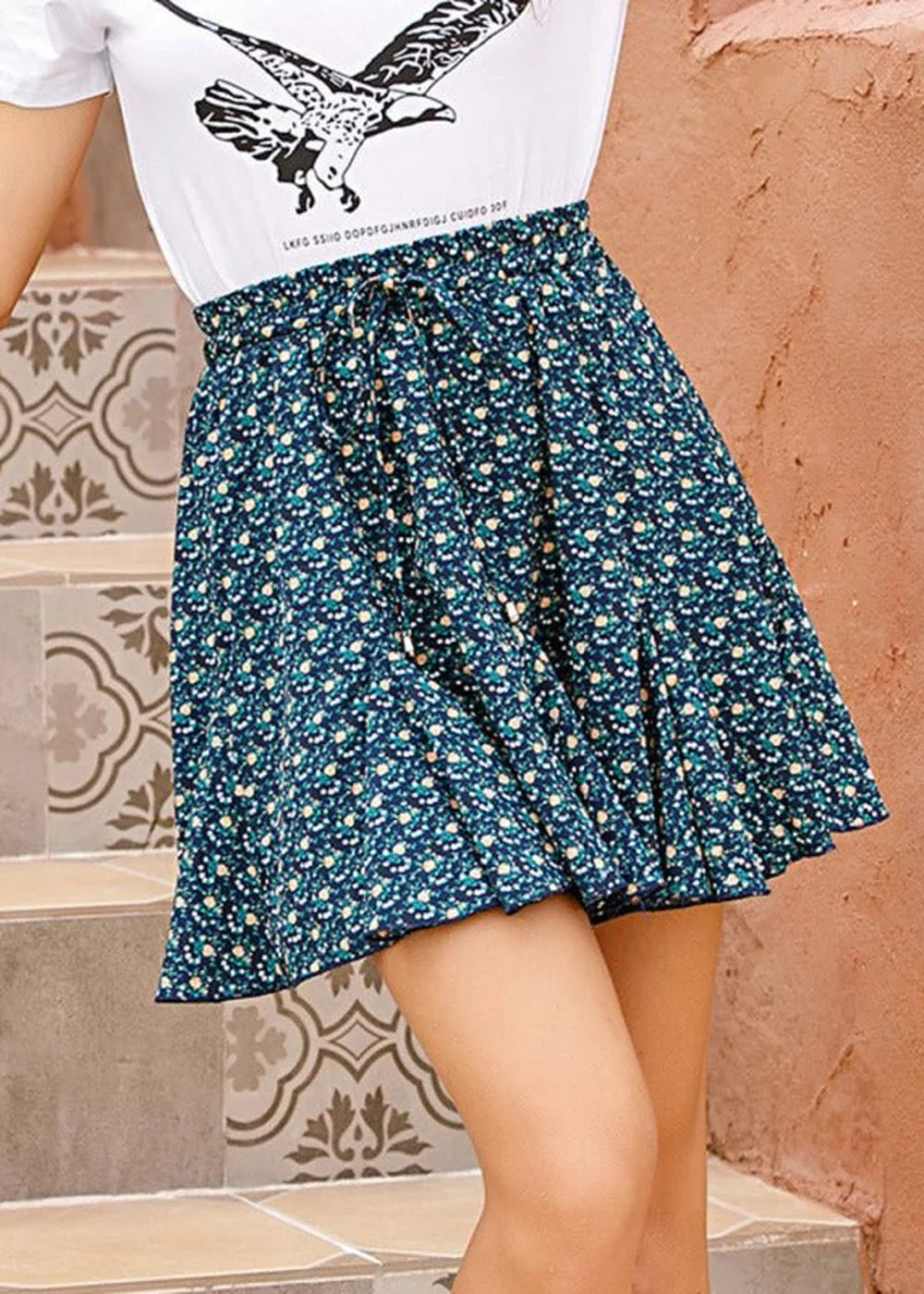 Navy blue floral print skirt with a tie-waist detail
