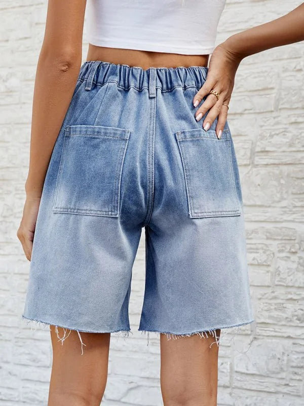 Light wash denim shorts with frayed hem and back pockets, showing a relaxed fit.