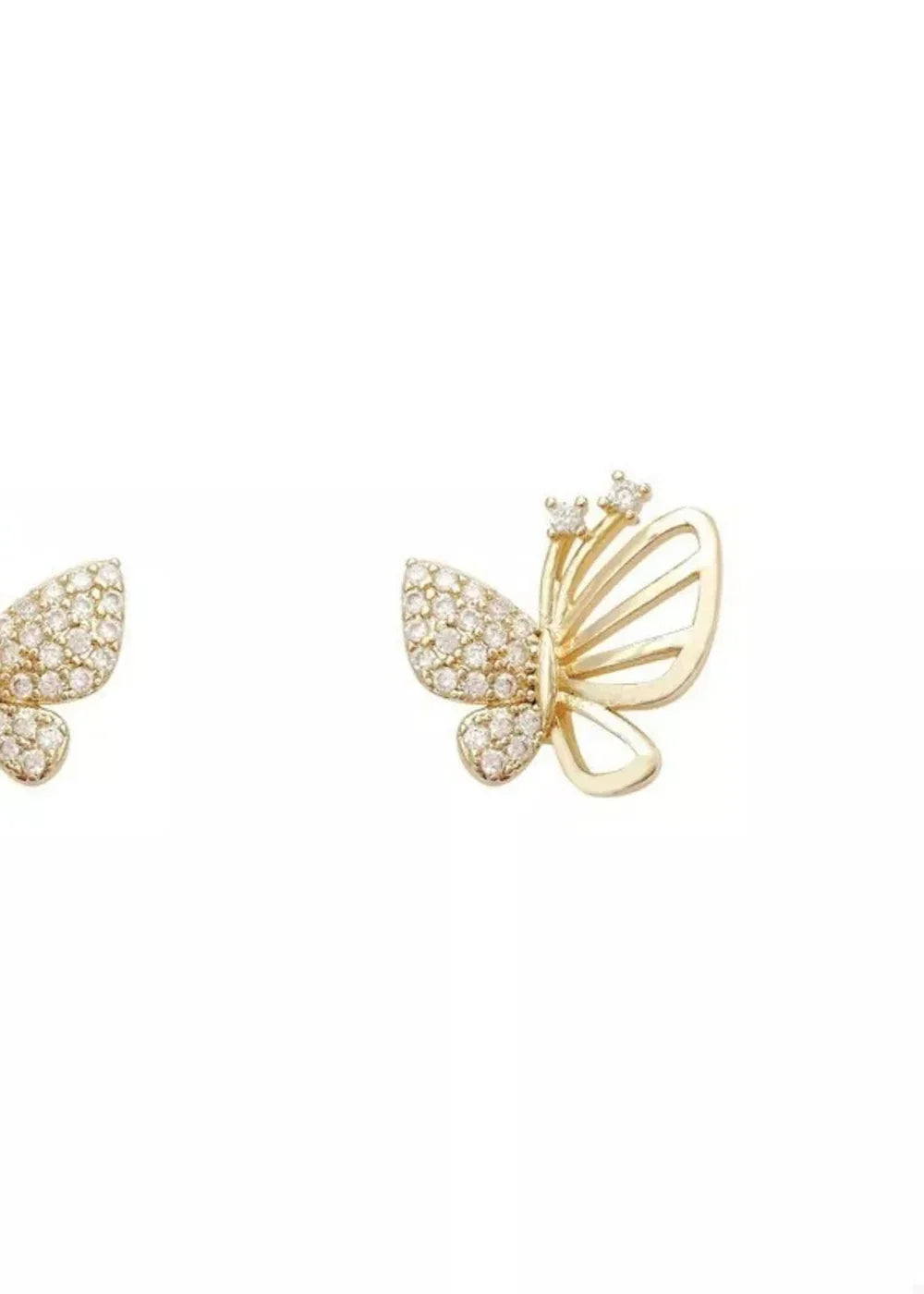 Gold butterfly earrings with clear rhinestones on white background