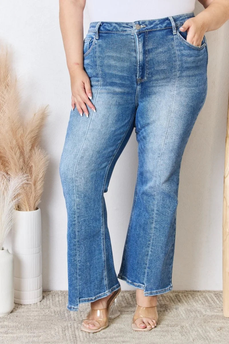 Light wash, flared denim jeans with front seams and a high waist, on a model.
