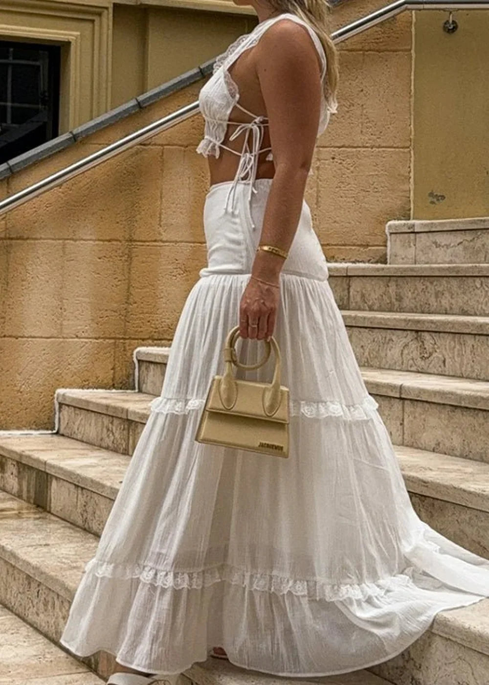 Cream tiered maxi skirt with delicate lace trim and a matching cropped lace top.