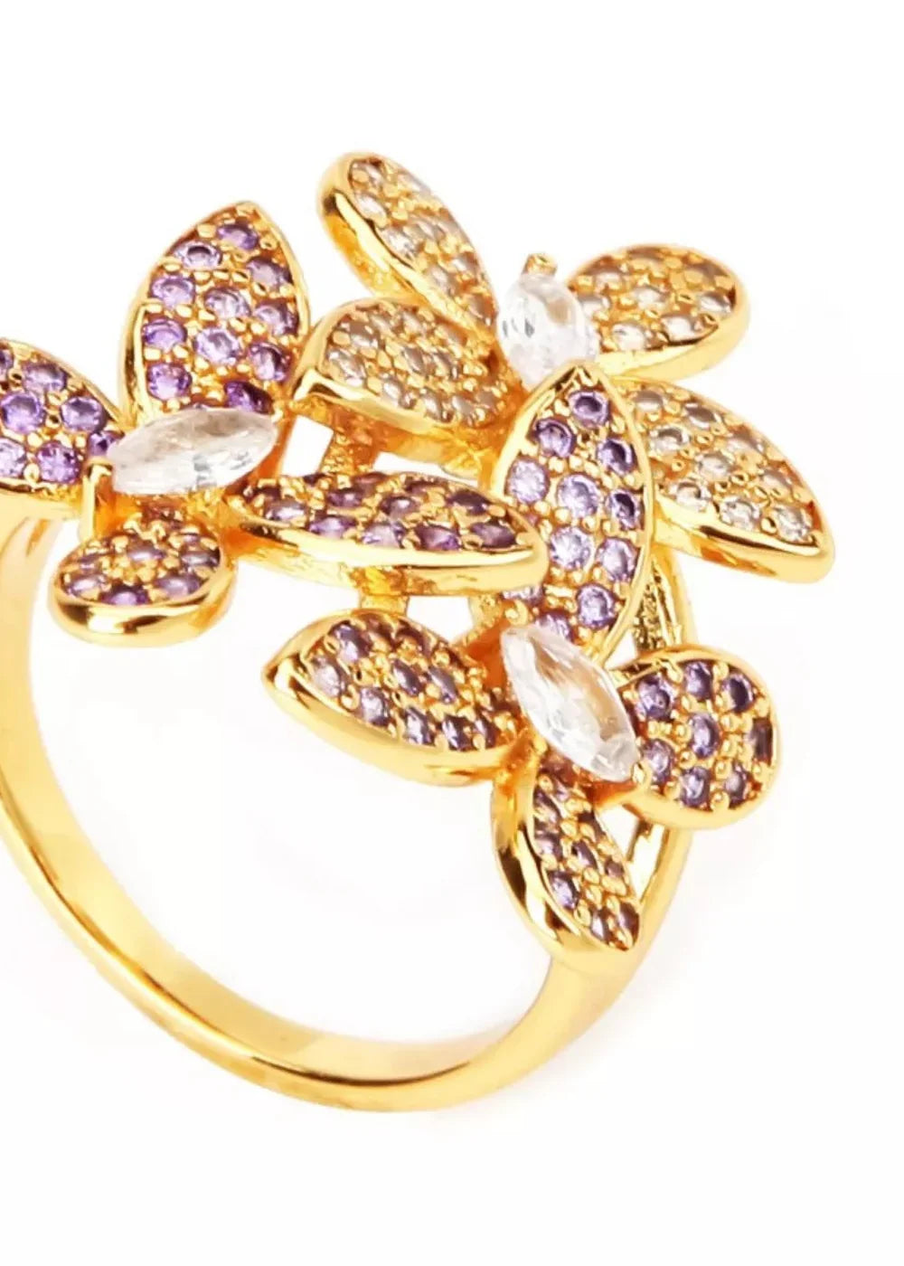 Gold ring with butterfly-shaped embellishments adorned with purple and clear rhinestones and cubic zirconia.