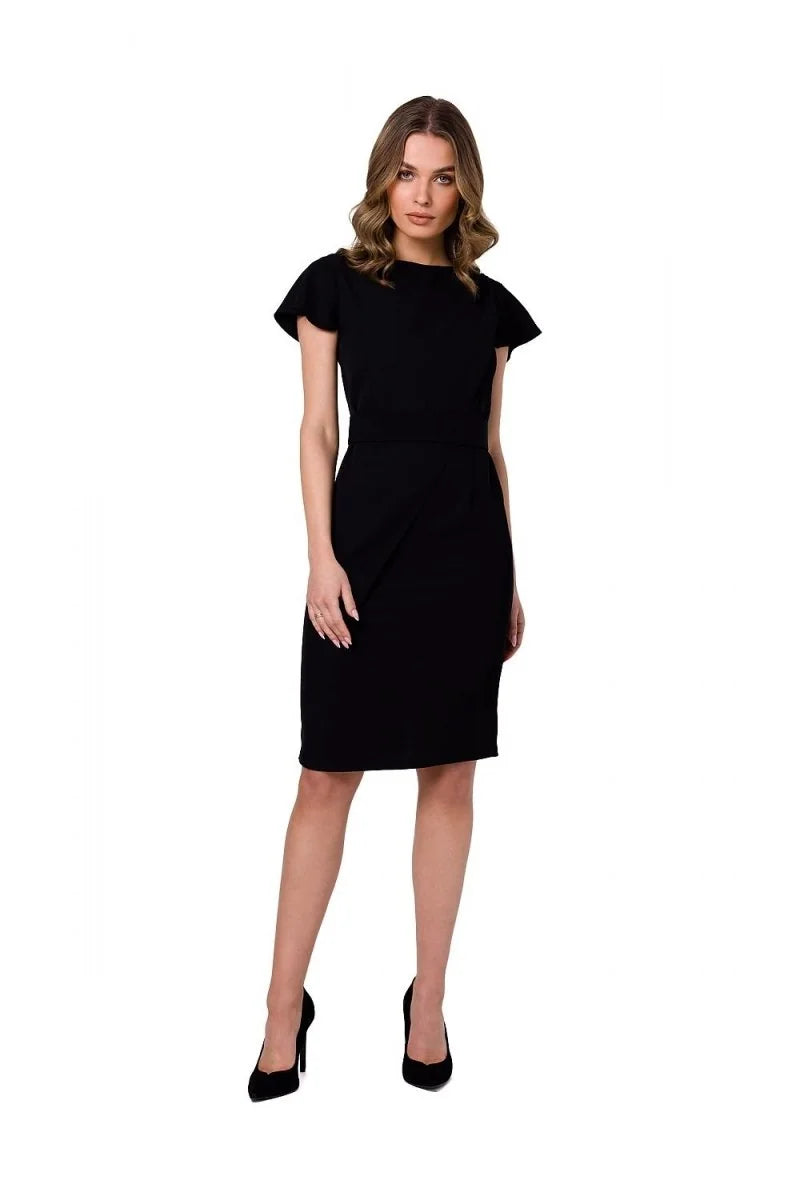 Black knee-length cocktail dress with cap sleeves, cinched waist, and subtle front draping, worn by a model.