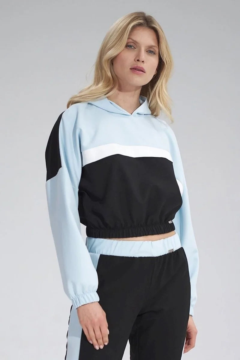Light blue and black cropped hoodie with white stripe detail and elastic waistband, worn by a model.