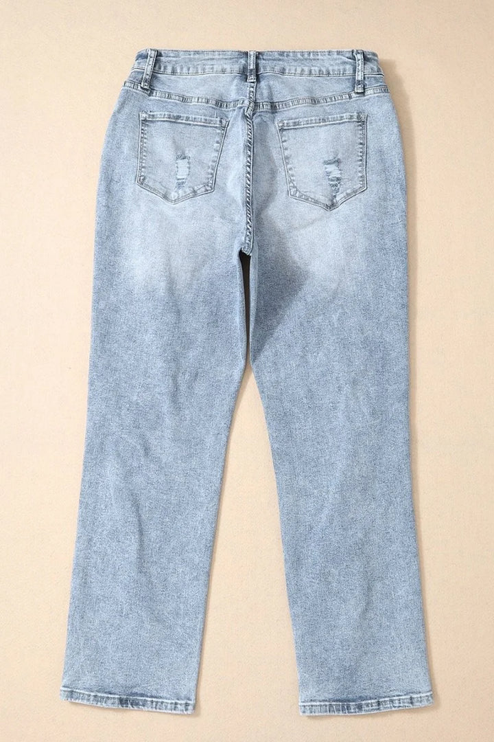 Light wash high-waisted denim jeans with distressed details and a straight leg.