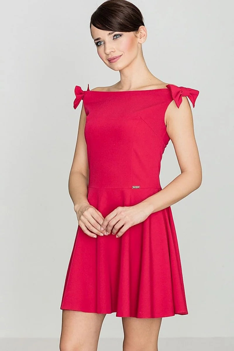 Red cocktail dress with off-the-shoulder neckline and bow details on straps.