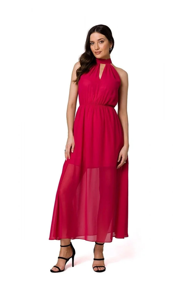 Full-length pink chiffon halter maxi dress with a keyhole neckline and black strappy heels.