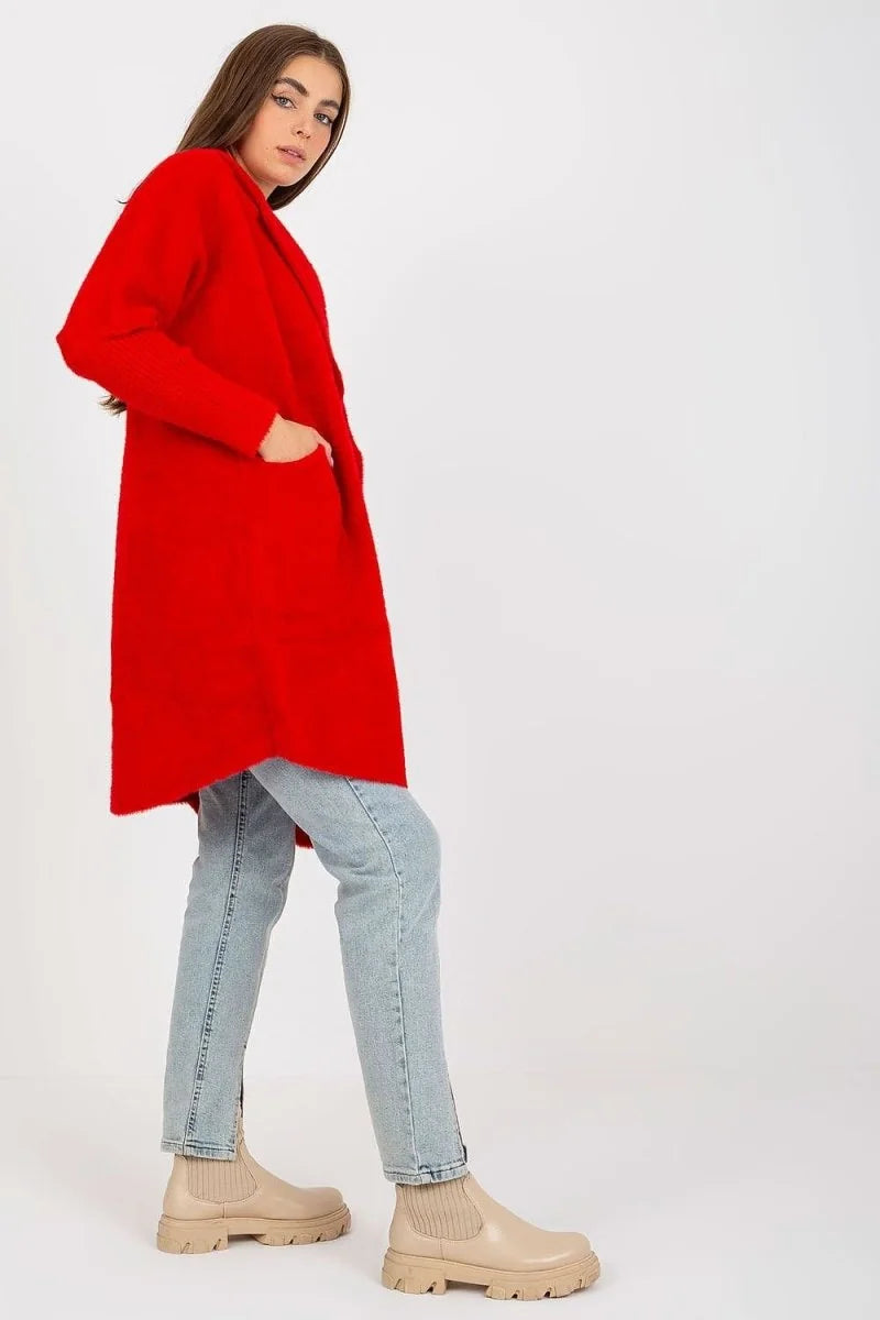 Red angora and wool blend longline cardigan with pockets, worn by a model with light wash jeans and beige boots.